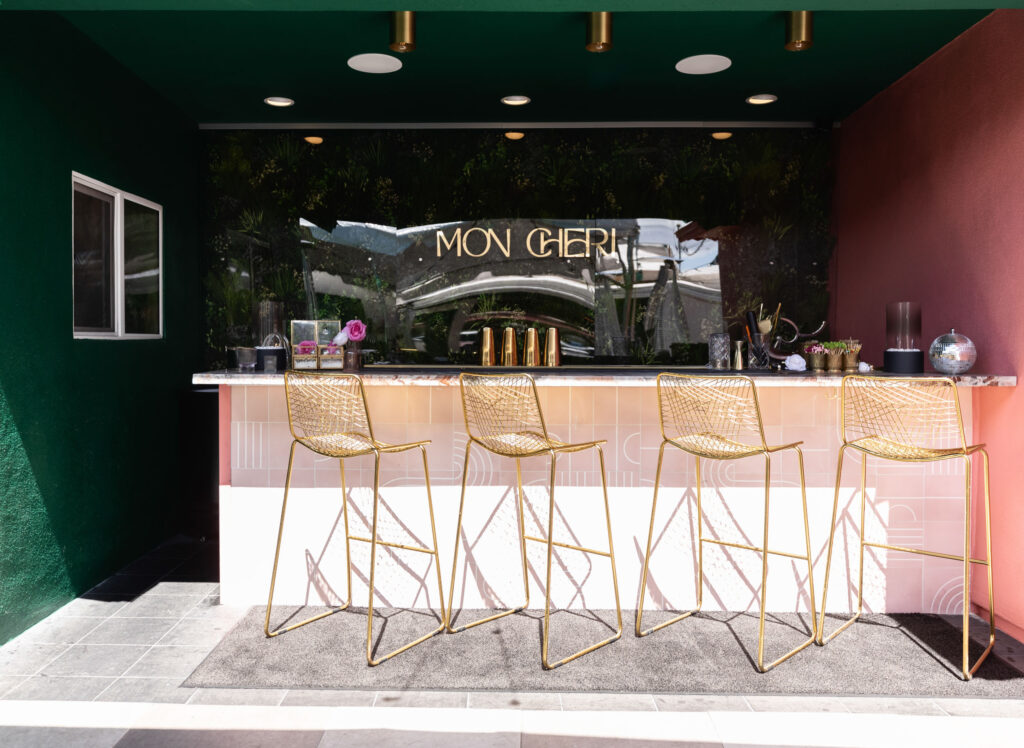 Exterior bar design with gold chairs.